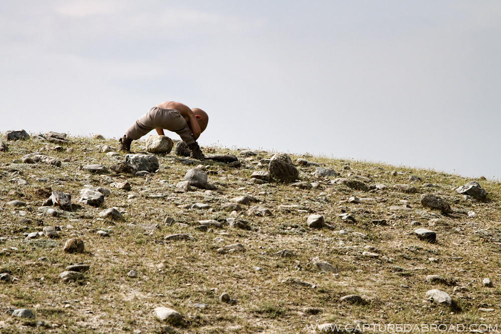 Kid playing on a hill by the Khurgan Nuur Mongolia