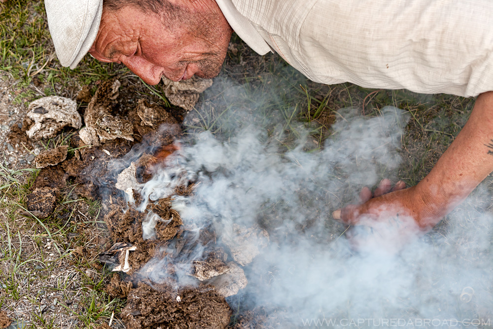 Cow dung fire, cooking fish from Khurgan Nuur, Mongolia